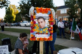 People install a memorial for Silverio Villegas González on Sept. 15, 2025, in Franklin Park. Villegas González was shot and killed by an Immigration and Customs Enforcement officer during a traffic stop. (Armando L. Sanchez/Chicago Tribune)
